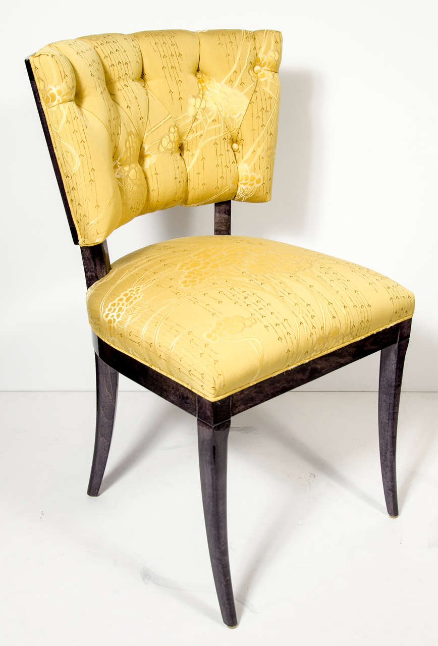 This pair of Mid-Century tufted back klismos style chairs in the manner of Billy Haines in ebonized walnut, fine splayed tapered legs and newly upholstered in Gustav Klimt inspired citrine cherry blossom design fabric. Restored to mint condition.