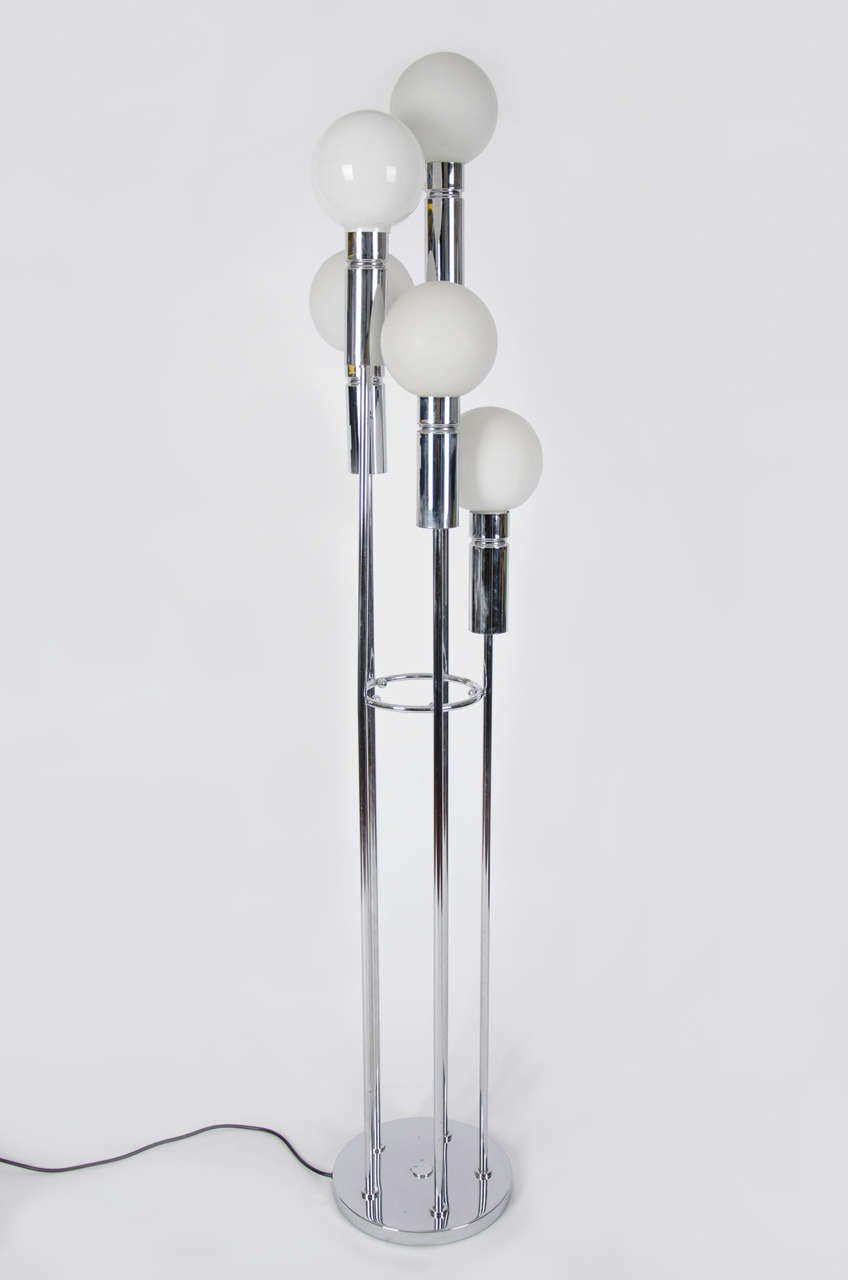 A 1950s globe floor lamp.<br />
One globe is a new replacement.