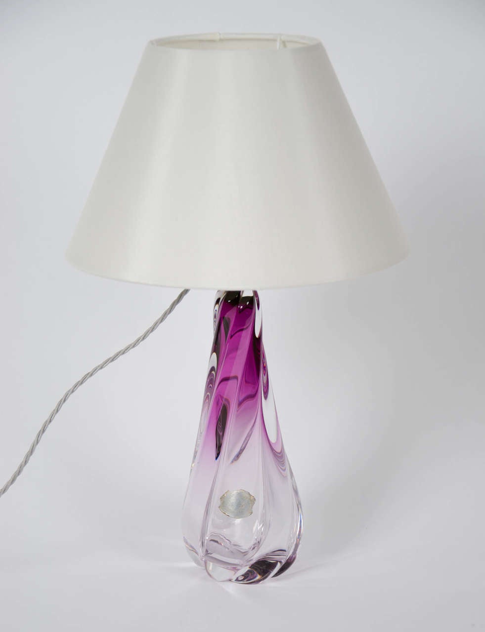 A fine example from the Belgian glass manufacturer. 'Twisted' glass table lamp, with the manufacturer's stamp.