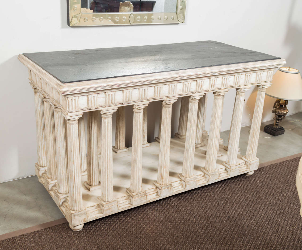 Hand-painted and antiqued slate top architectural center table. Rectangular charcoal slate top raised on a base in the form of a classical temple, the frieze of traditional form with triglyphs and metopes raised on a series of fluted Doric column