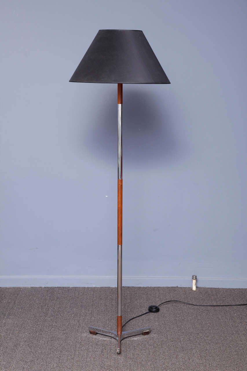 Italian origin standing lamp . The frame is in metal and wood, black colored shade.