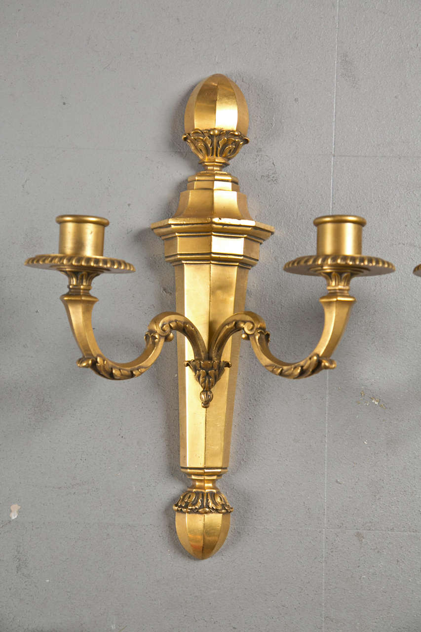 Pair of Neoclassical style gilt bronze Caldwell sconces, circa 1920s.