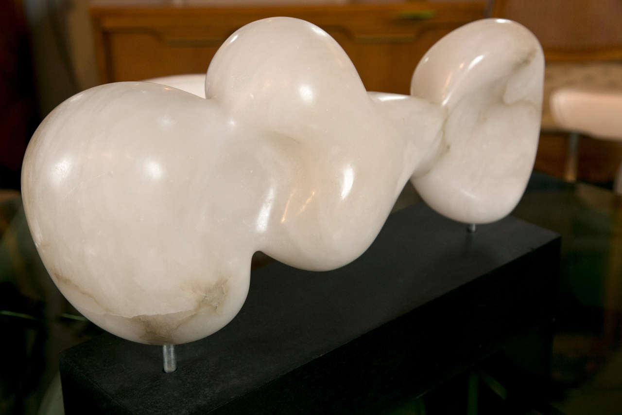 A signed Italian alabaster sculpture by artist Claudia Renfro.