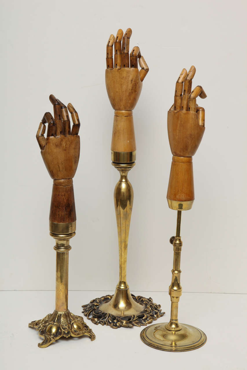 Set Of Three Vintage Articulating Glove Display Models With Decorative Brass Mounts Stands.