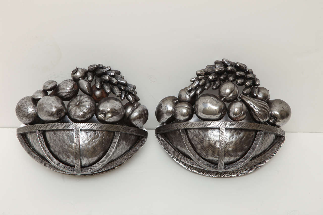 Set Of Four Forged Silvered Iron Sconces With Sculpted Fruit Bowl Motif.