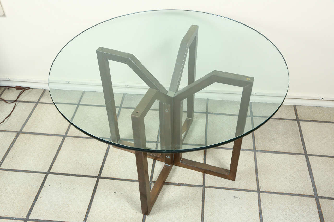 Very nice occasional table with a Geometric design to the  finished bronze base which supports a 3/4