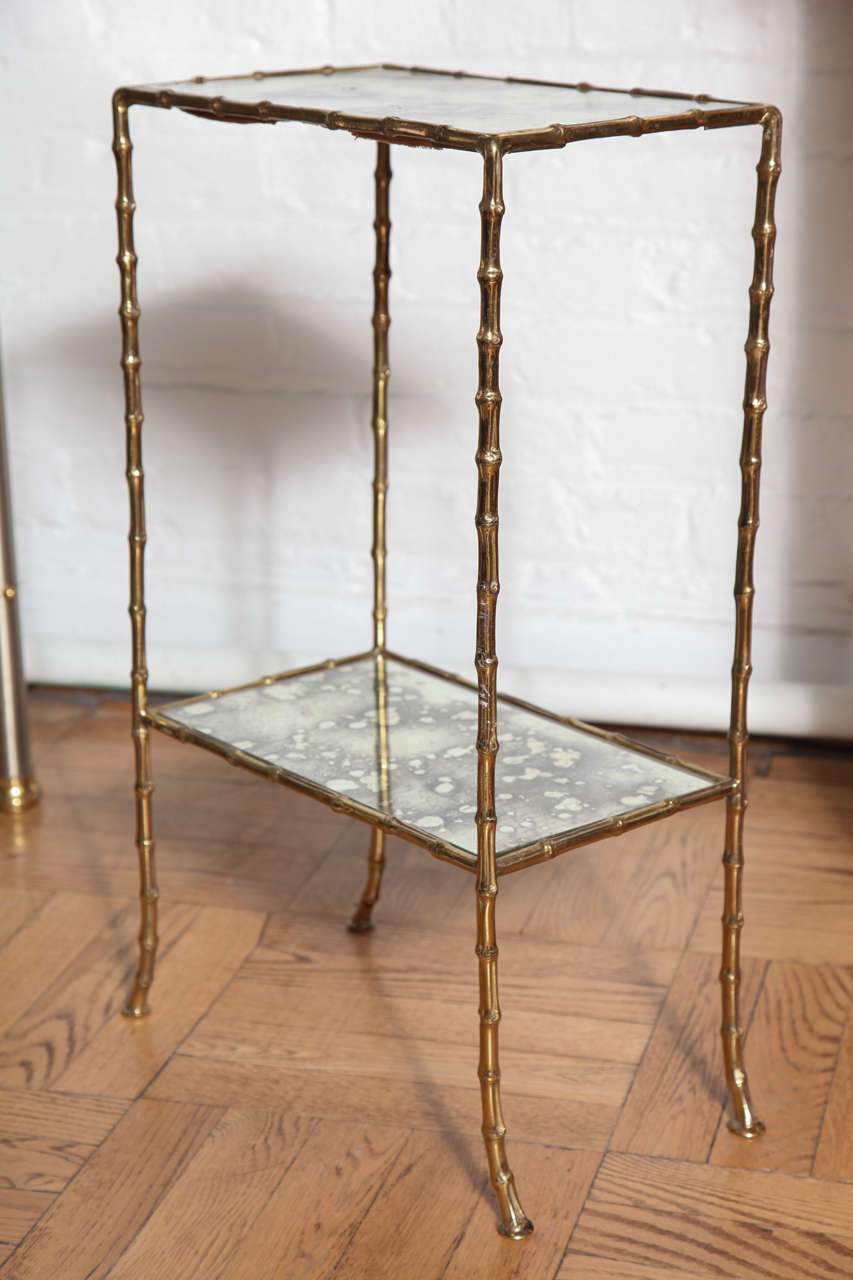French A Gilt Brass and Antiqued Mirror Faux Bamboo Etagere Table. France c. 1950