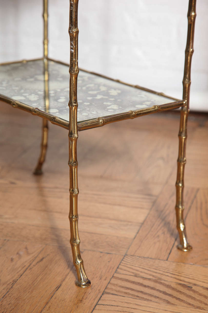 A Gilt Brass and Antiqued Mirror Faux Bamboo Etagere Table. France c. 1950 2