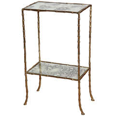 A Gilt Brass and Antiqued Mirror Faux Bamboo Etagere Table. France c. 1950