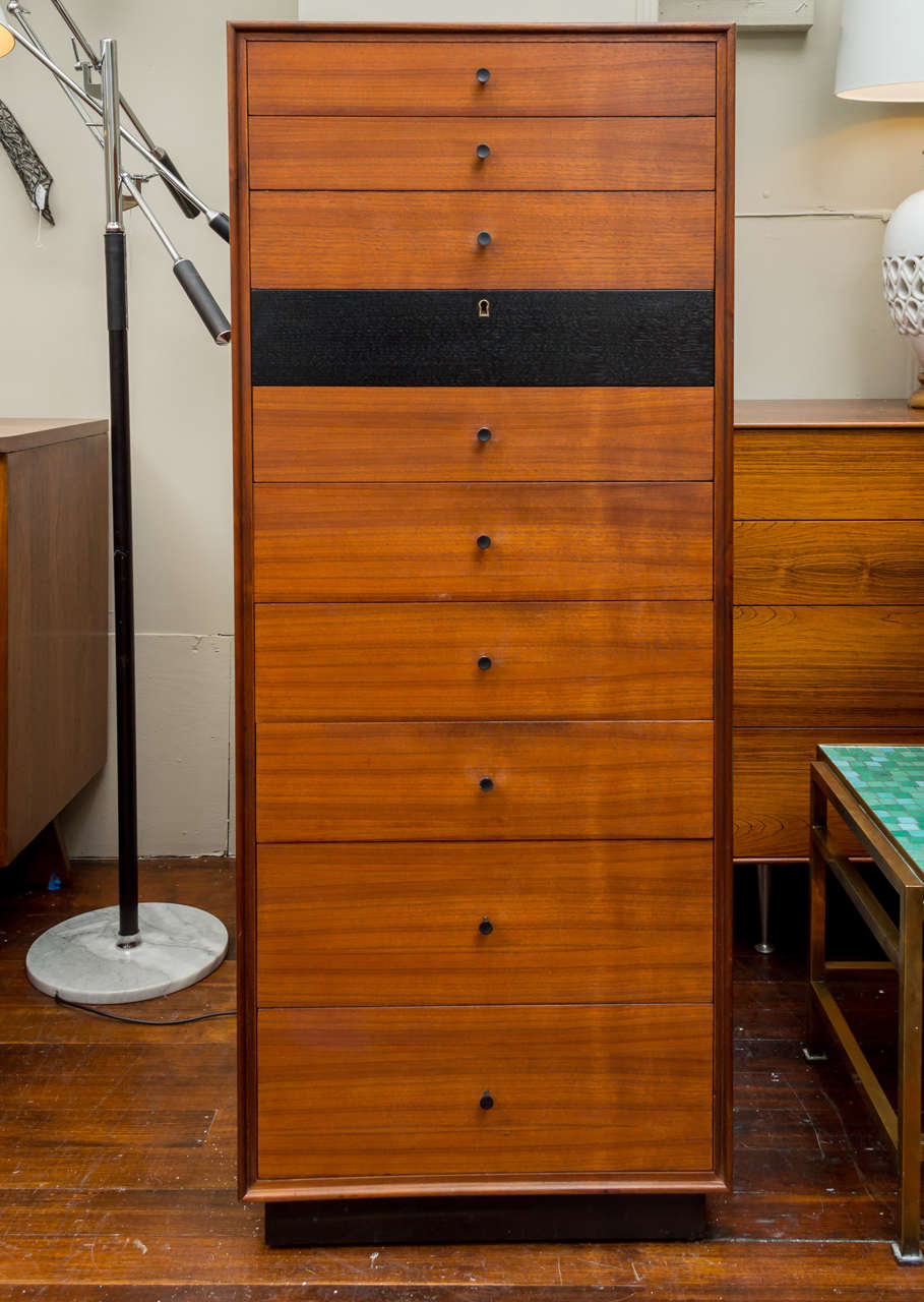 Designed by Kipp Stewart and Stewart Macdougall for Glenn Furniture Co. 
Rare design often referred to as a jewelry chest because of locking center black front drawer.
Perfectly refinished and labeled.