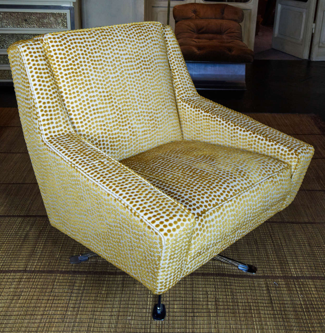 Pair of Italian armchairs, newly reupholstered in yellow dot velvet fabric, chromed base.