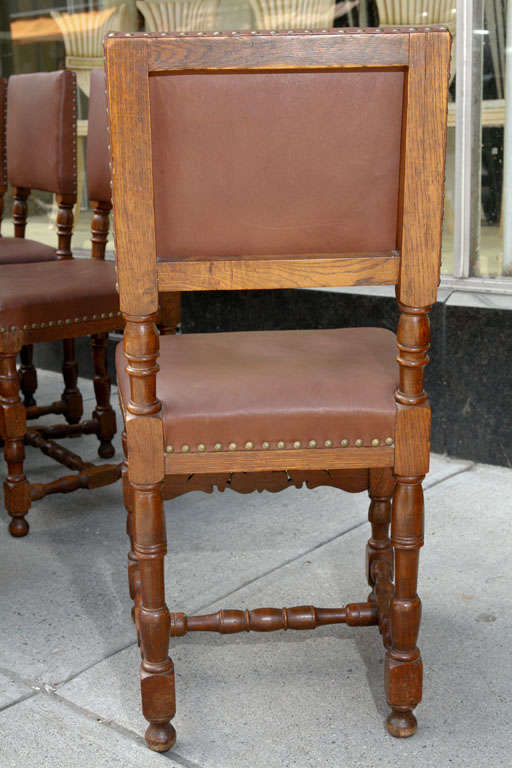 Renaissance Revival Set of Ten Leather and Oak Dining Chairs For Sale