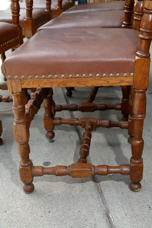 20th Century Set of Ten Leather and Oak Dining Chairs For Sale