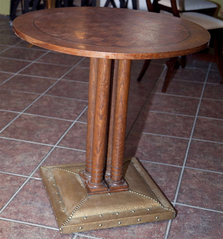 Oak round table with checkerboard top and metal bottom