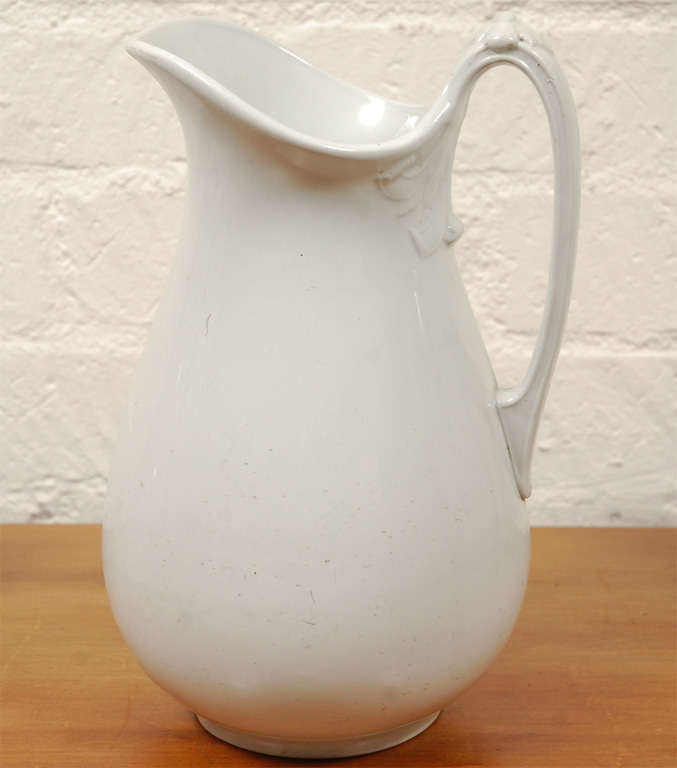 A selection of the white ironstone pitchers we keep in stock. They are usually late 19th or early 20th century in age, English or American, white in color, most have decorative molded elements and a makers mark on the bottom. Normally priced at