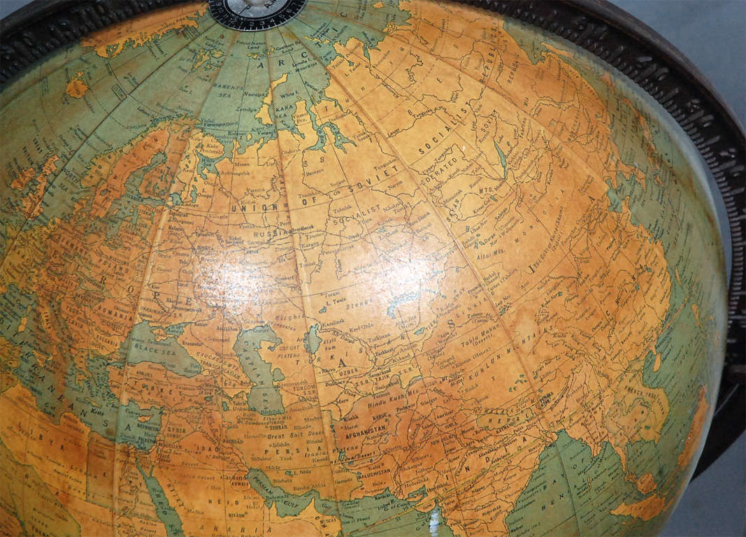 vintage globe on wooden stand