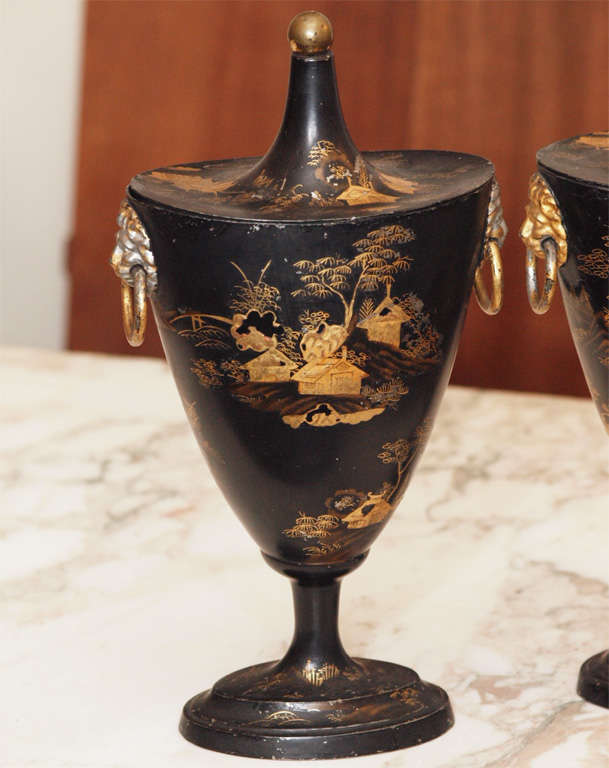 Early 19th c. painted chinoisoire decorated tole chestnut urns.