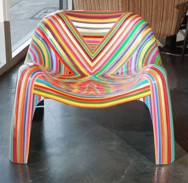 A pair of vintage fiberglass armchairs originally Sergio Mazza and updated with colorful vinyl stripes by Brazilian artist, Mauro Oliveira. Mauro has named this unique pair of chairs -- Hard Candy. Each piece is coated in hard resin. Each chair is