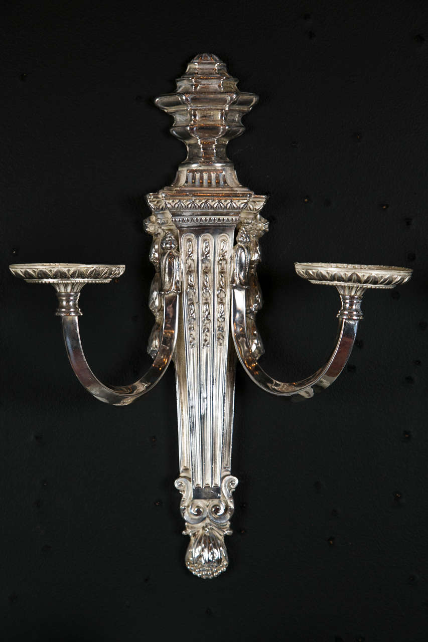 A set of 4 circa 1920's Caldwell silverplated sconces. Neoclassical style.
