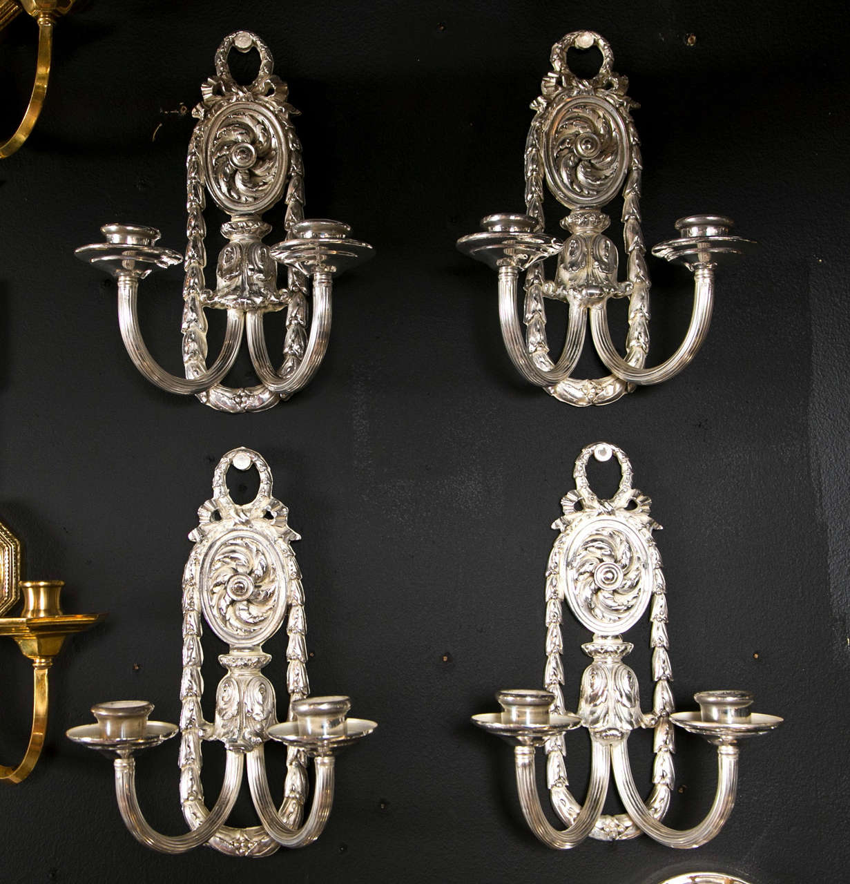 A Pair of ornate silver plated Caldwell sconces circa 1920. 
