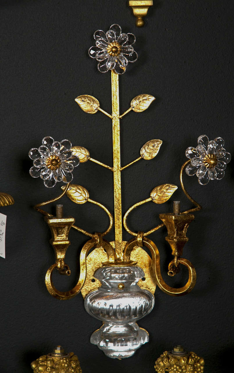 A Beautiful and ornate pair of French Bagues sconces circa 1930.
