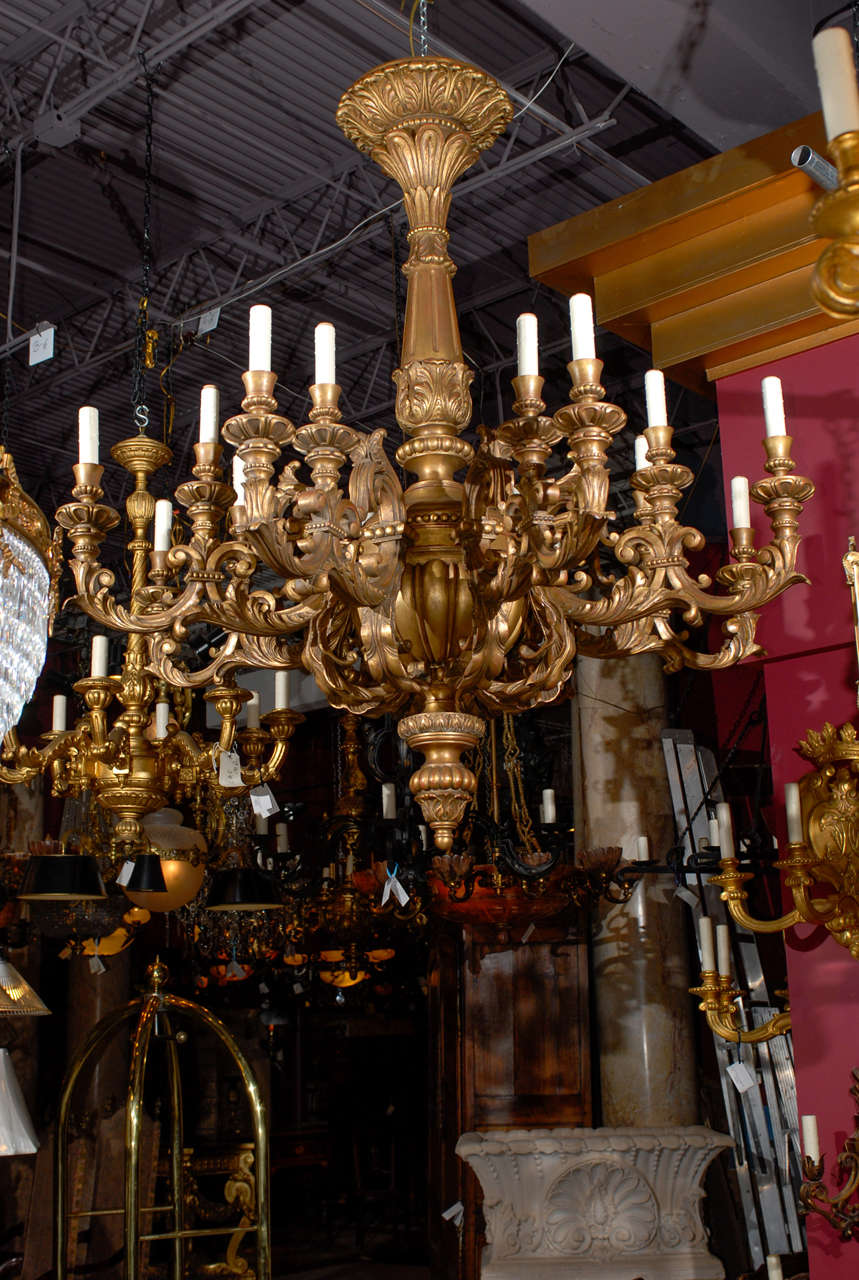 Incredible hand carved giltwood chandelier with sixteen lights