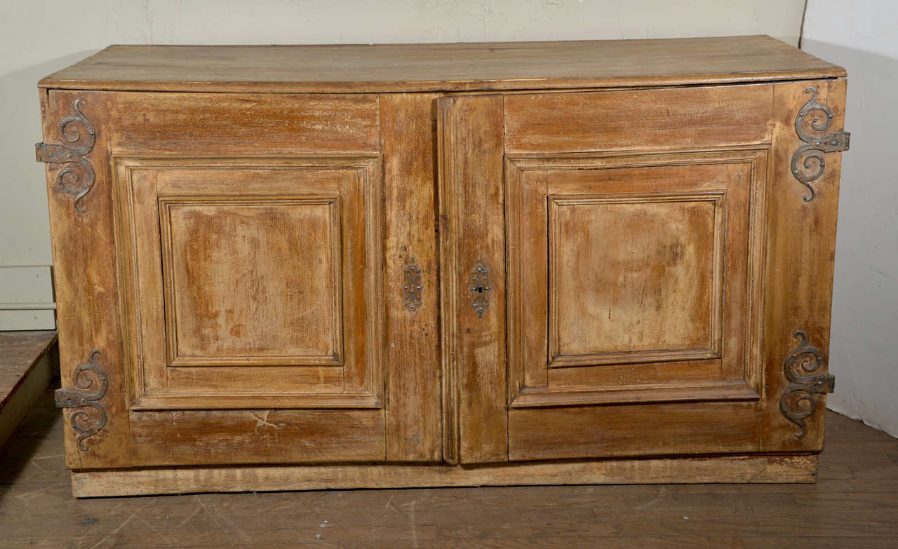 18th century four drawer painted linen chest with 19th century doors added.