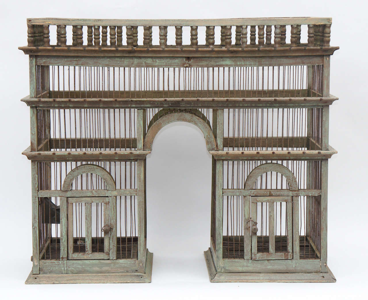 A wonderfully large bird-cage in a classic architectural style.
A home for a small family of diminutive birds.
Great painted surface.