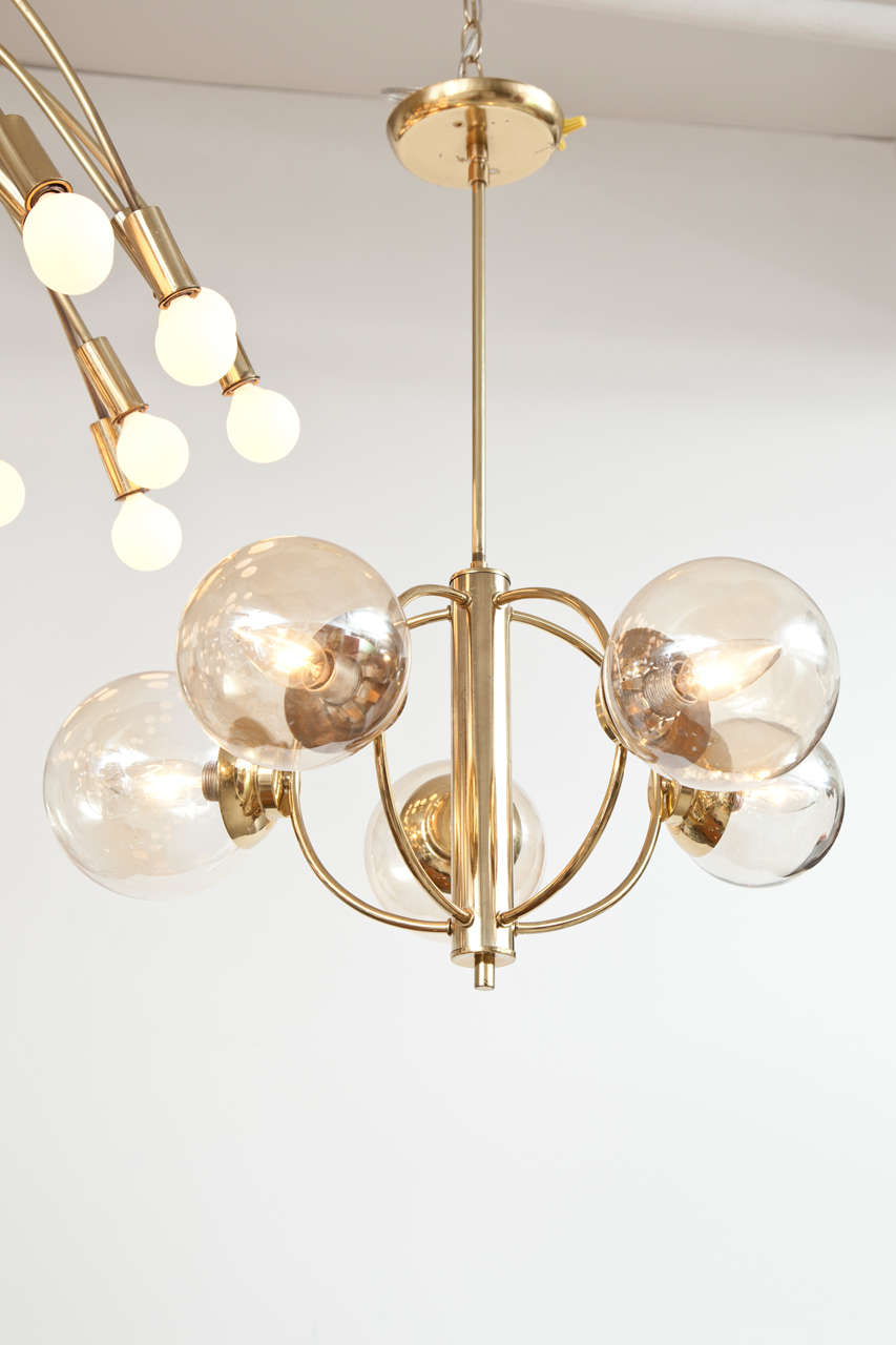 Vintage Italian chandelier with curved brass arms and five glass globes. Hand blown glass balls range from 4" - 6" in diameter.