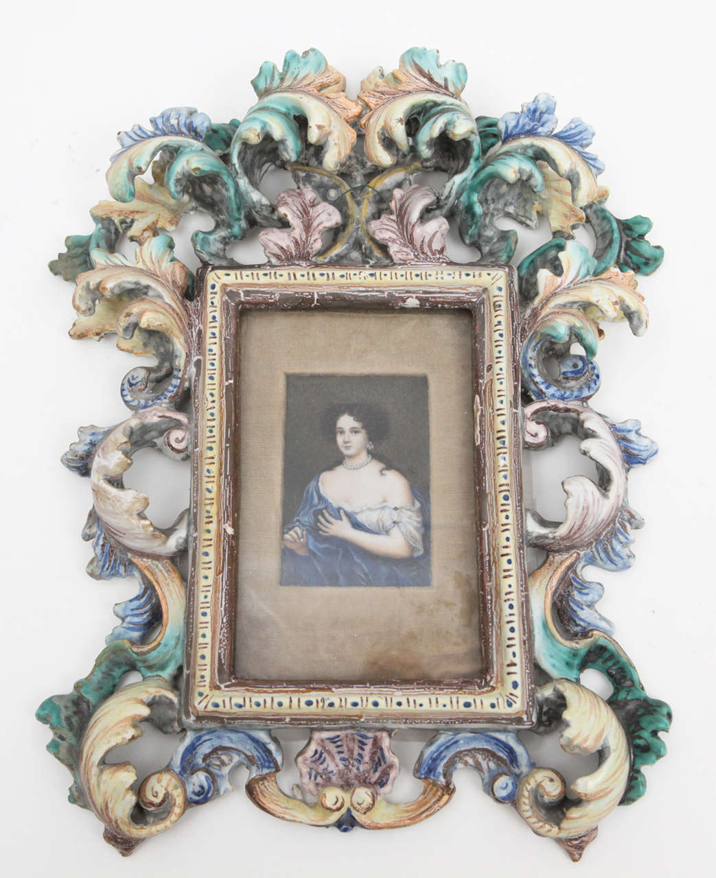 Highly unusual faience frame with maker mark holds a finely detailed portrait of a woman of importance for the time. Information is listed on back (see photos).