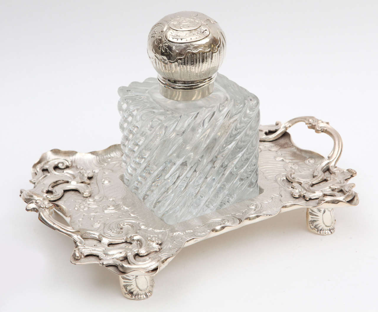 1900s English crystal and silver plated Sheffield inkwell on handled tray. The tray measurement is:
Depth: 10 inches.
Height: 2.75 inches.
Width: 14 inches.
The measurement below is for the inkwell.