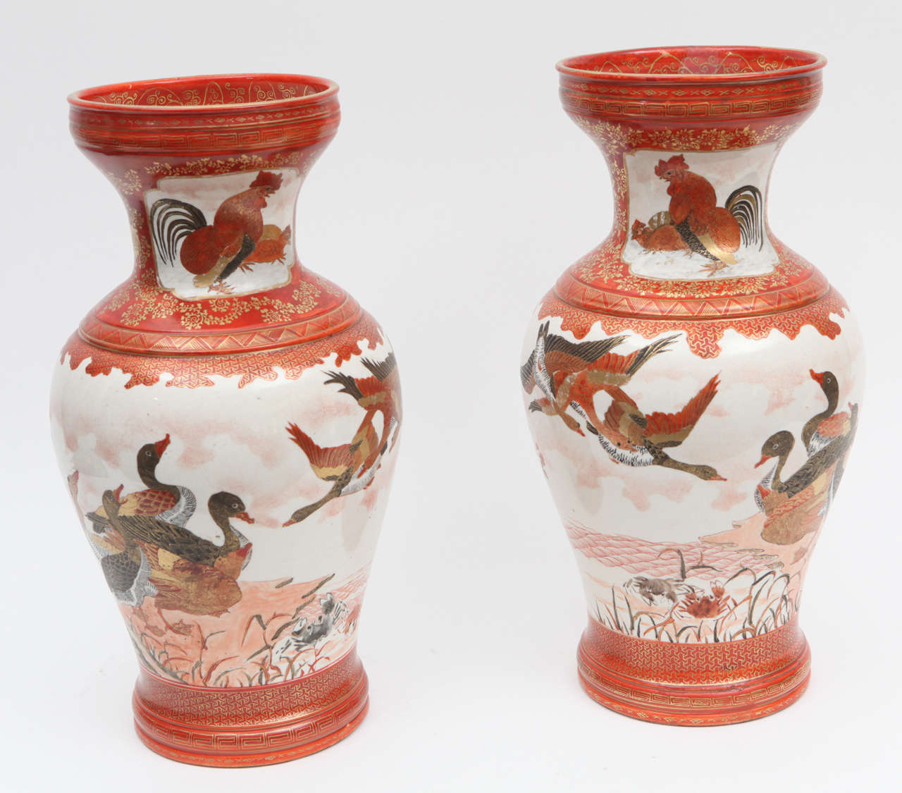 Pair of late 19th century Japanese hand-painted and gilded porcelain kutani vases. These vases are signed.