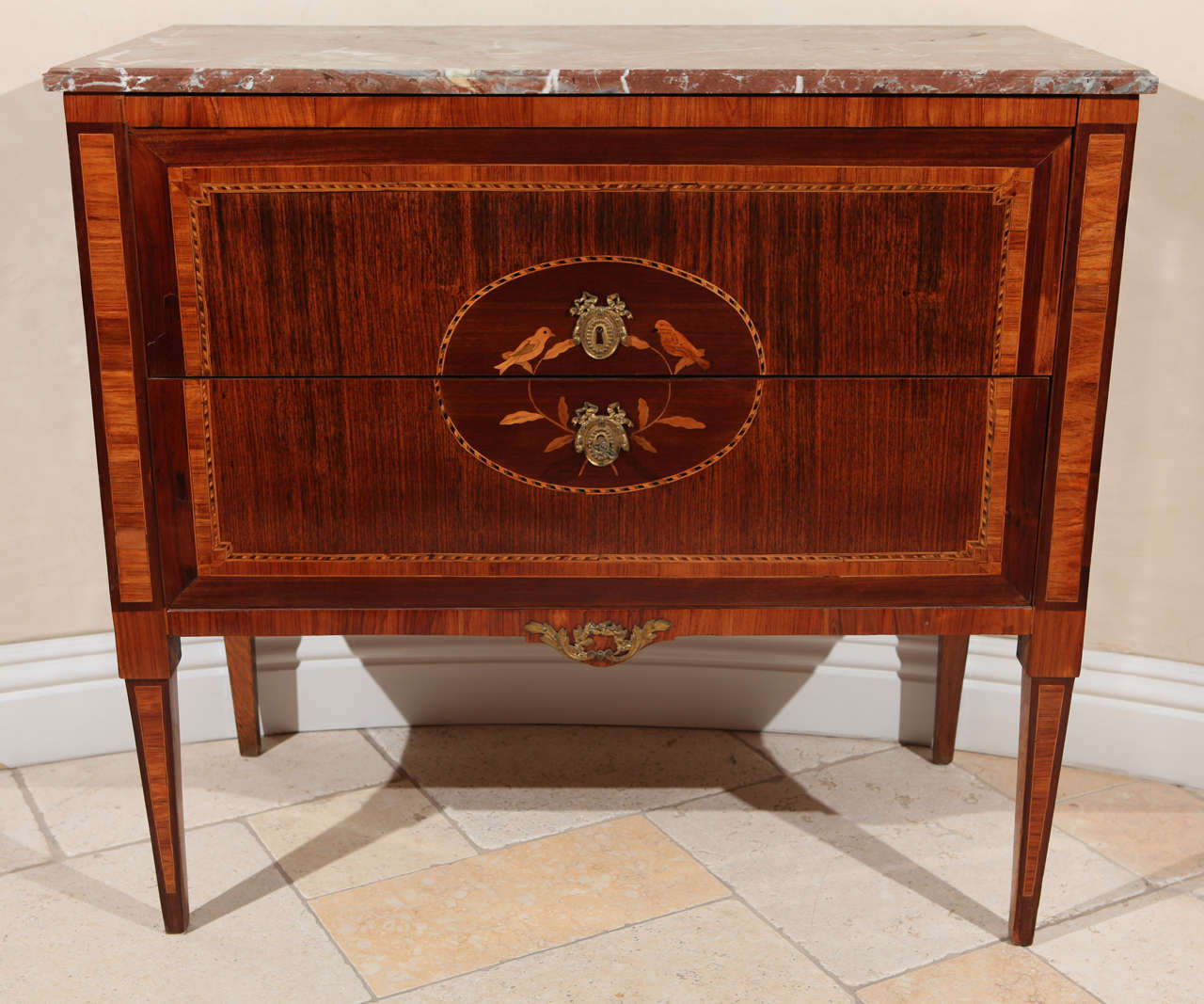 Early 19th century Italian Walnut two-Drawer Commode with Marble Top and Fruitwood Inlay of Bird and Flower Motif.  Stamped by Maker (SESSLE).The key is included and it is signed by the maker.  The marble top is original.