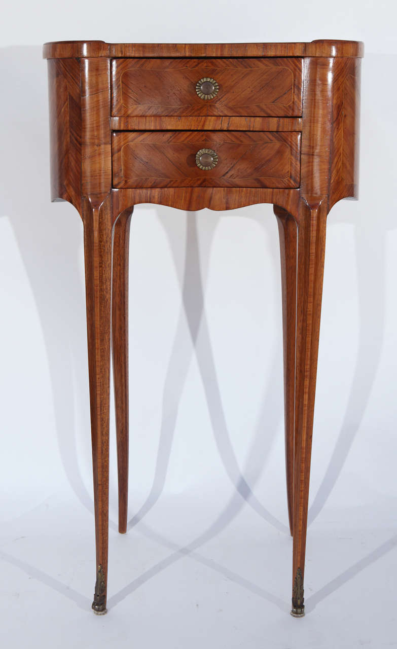 Pair of 1900s French two-drawer kidney shaped walnut end tables with bronze feet.