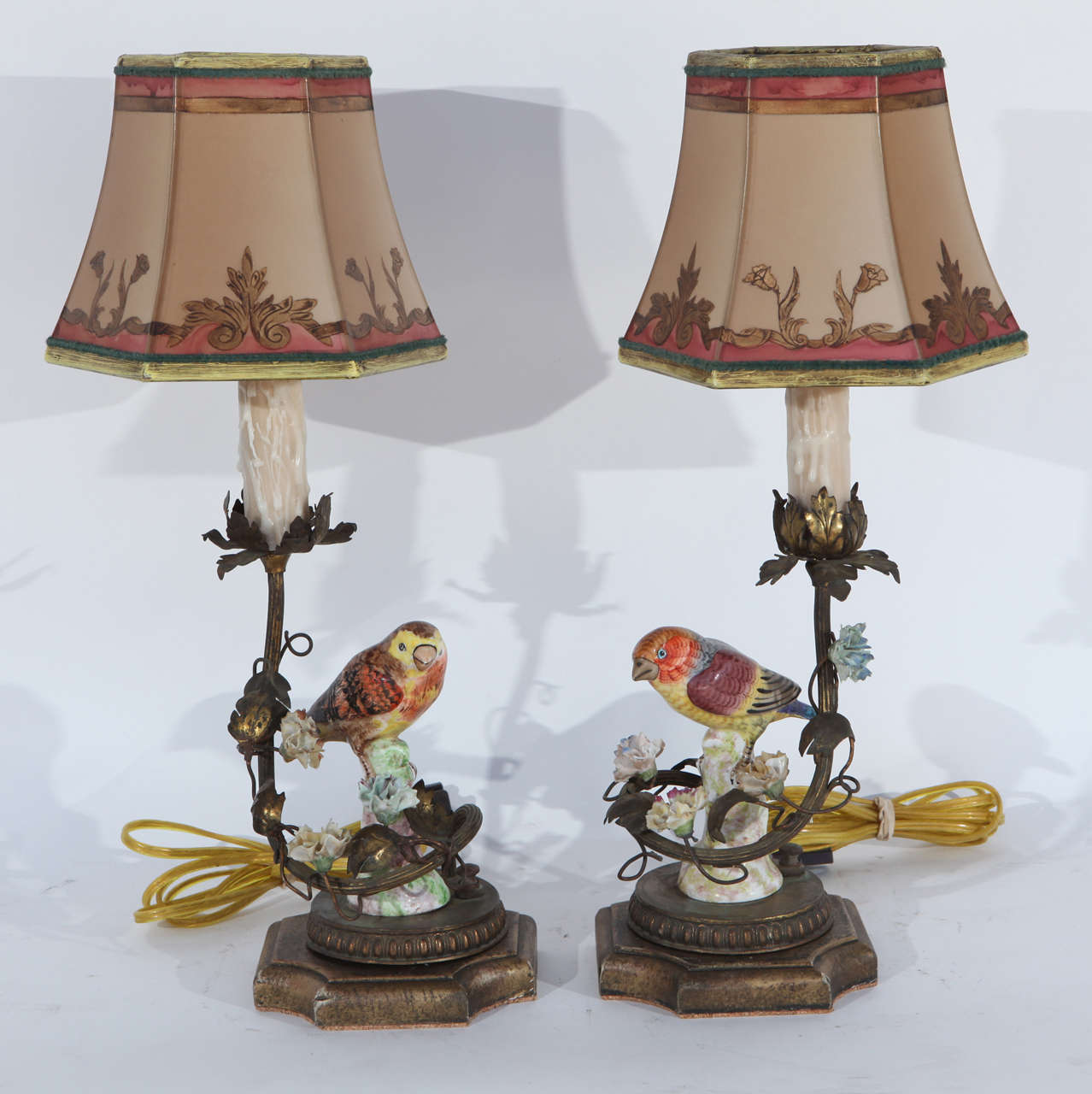 Pair of 1900's German Porcelain Birds converted to Lamps with French bronze mounting and porcelain flowers. The shades are included and are handmade of parchment paper. They are hand gilded and decorated. The lamps have been newly wired. The base