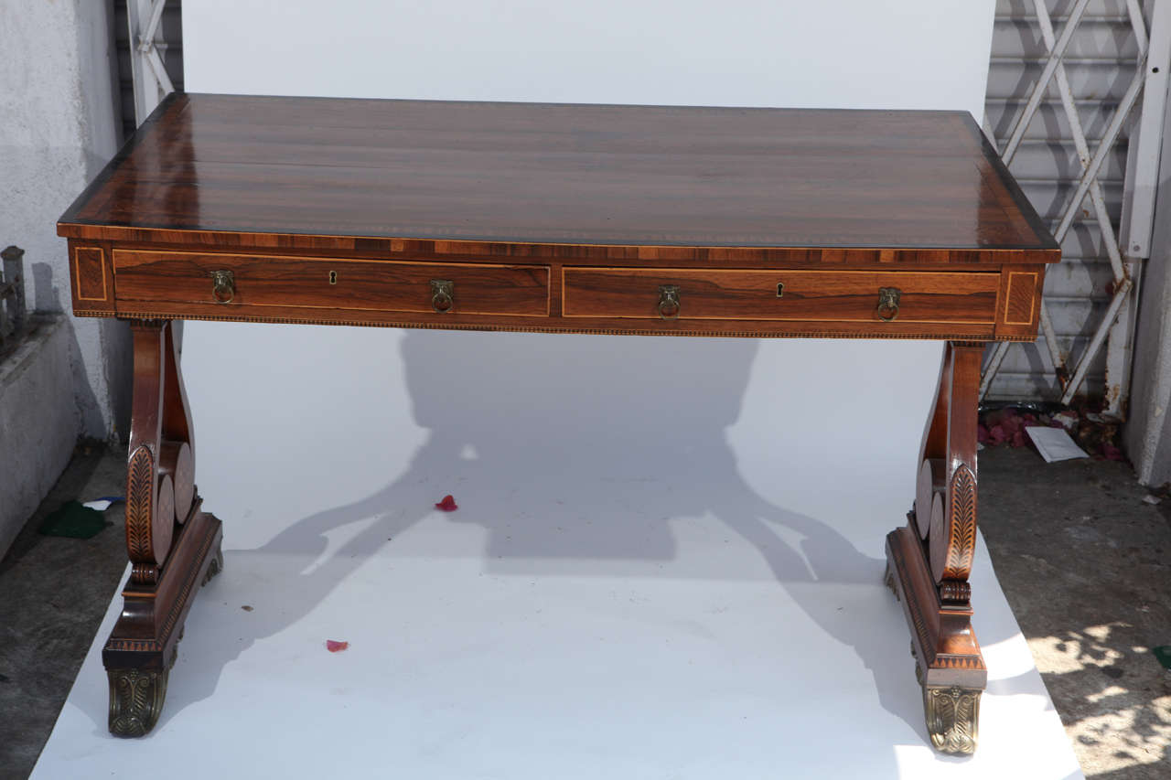 Period 19th century English Regency Desk with Satinwood inlay with two drawers and bronze mounted feet.