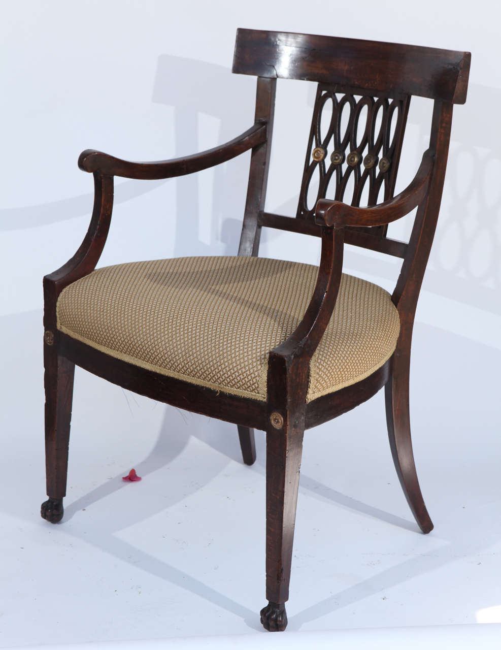 Single 18th century Italian walnut armchair with gilt details and claw feet.