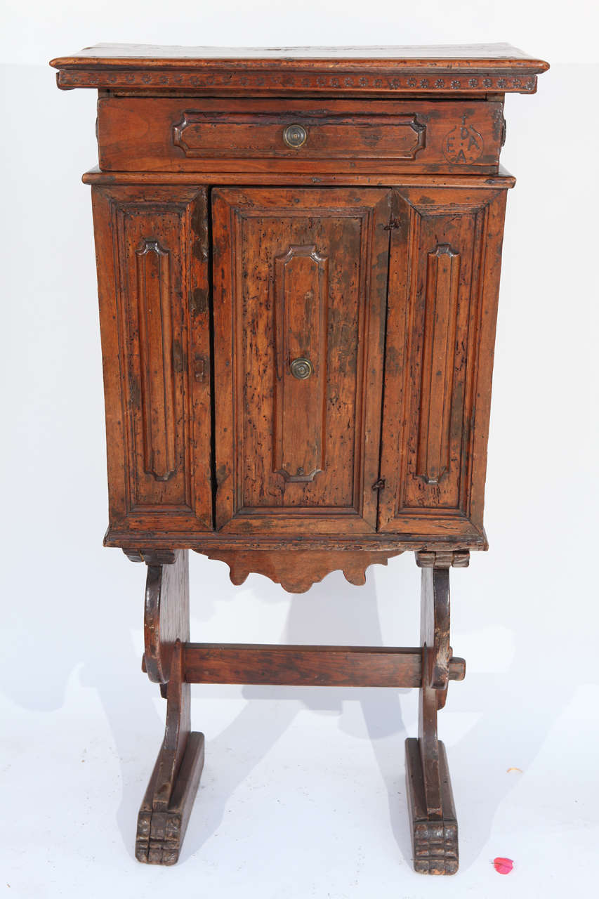 Early 18th century, Italian walnut cabinet on later date stand.