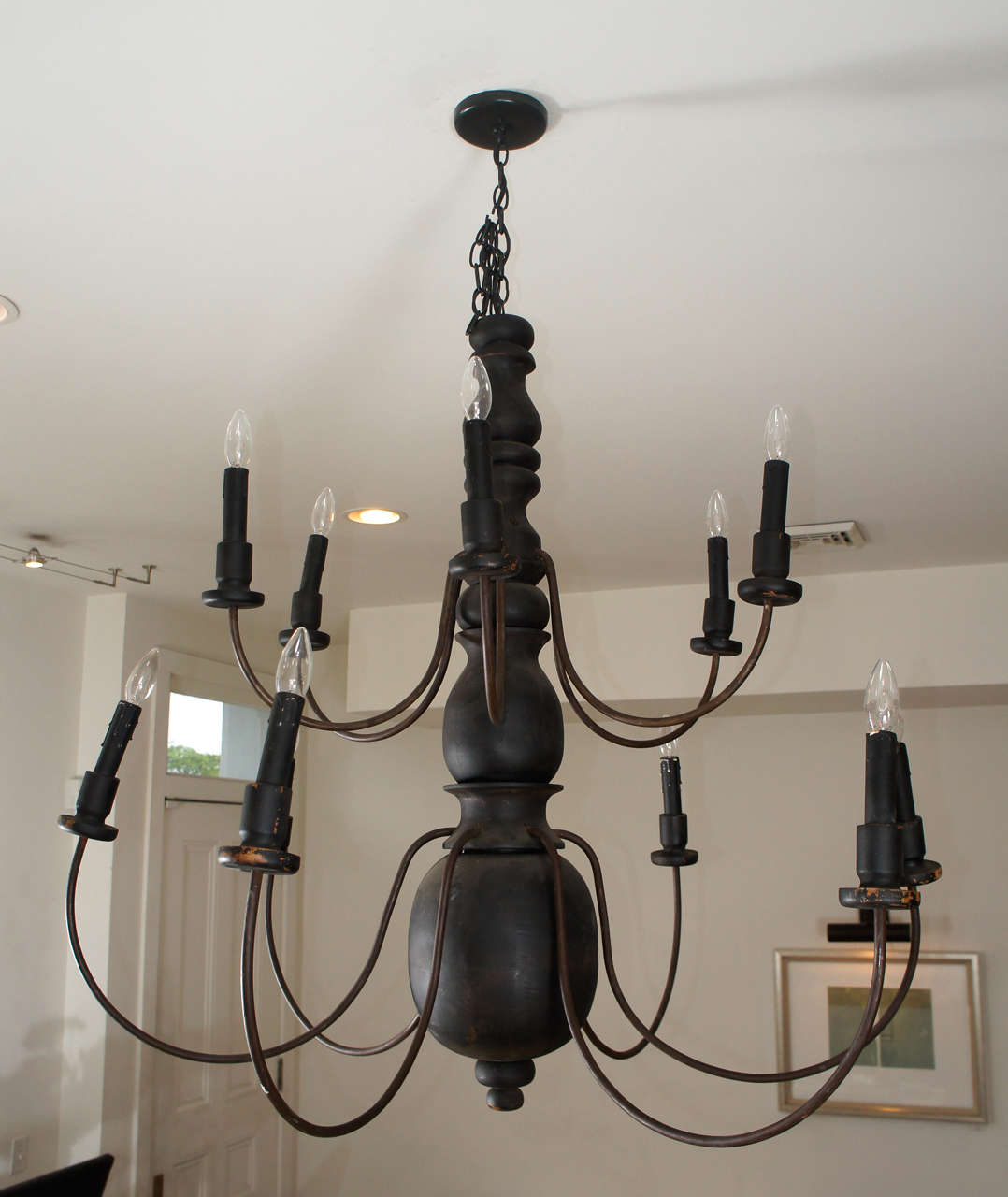 Vintage wrought iron and turned wood chandelier.<br />
Twelve arm, two tiers.