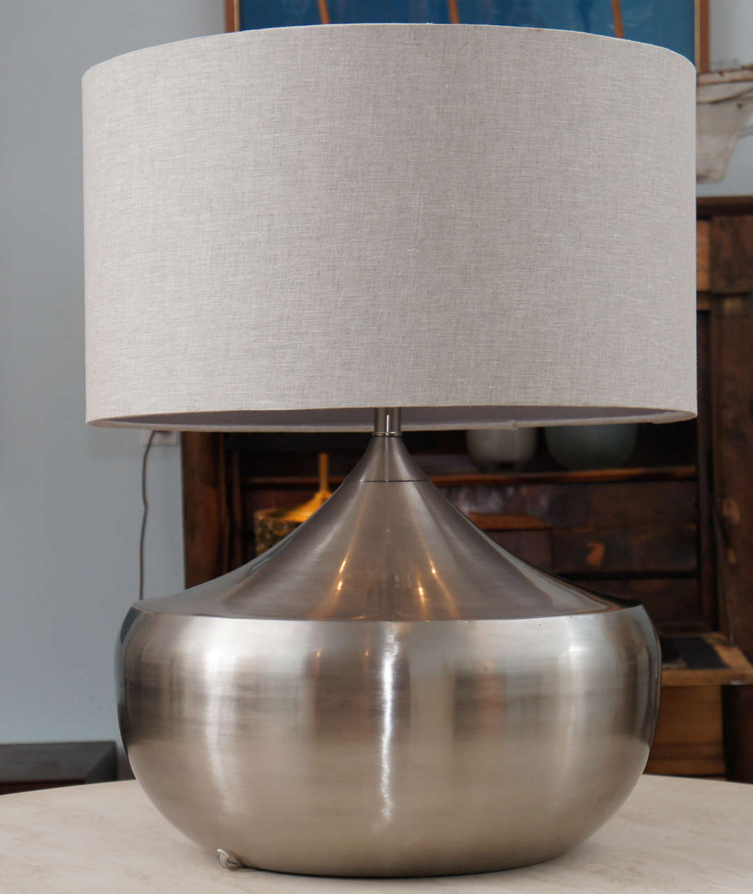 handsome, chrome table lamp, in a satin finish, with a gorgeous taupe, linen shade.