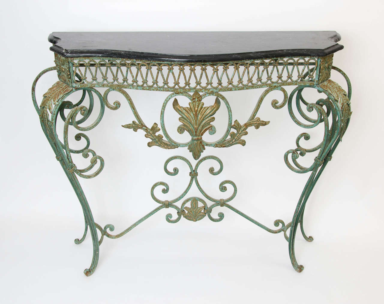 French console in the manner of Gilbert Poillerat, black marble top, prod. France, circa 1940.
Free shipping to London.