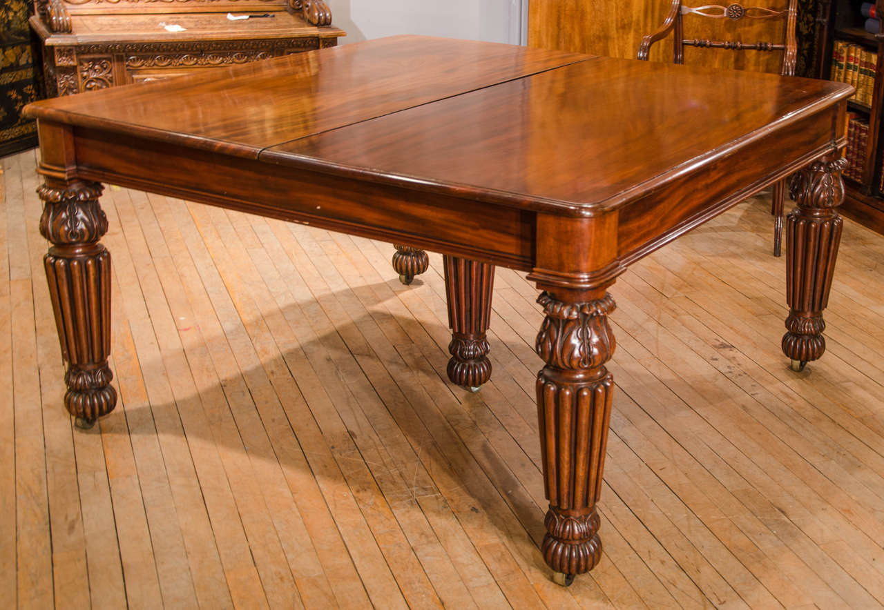 This majestic sized and very appealing mahogany dining table comes with four extension leaves which enable the table to accommodate up to 14 people comfortably. The table has a lovely warm patina and features a telescopic mechanism to add and remove