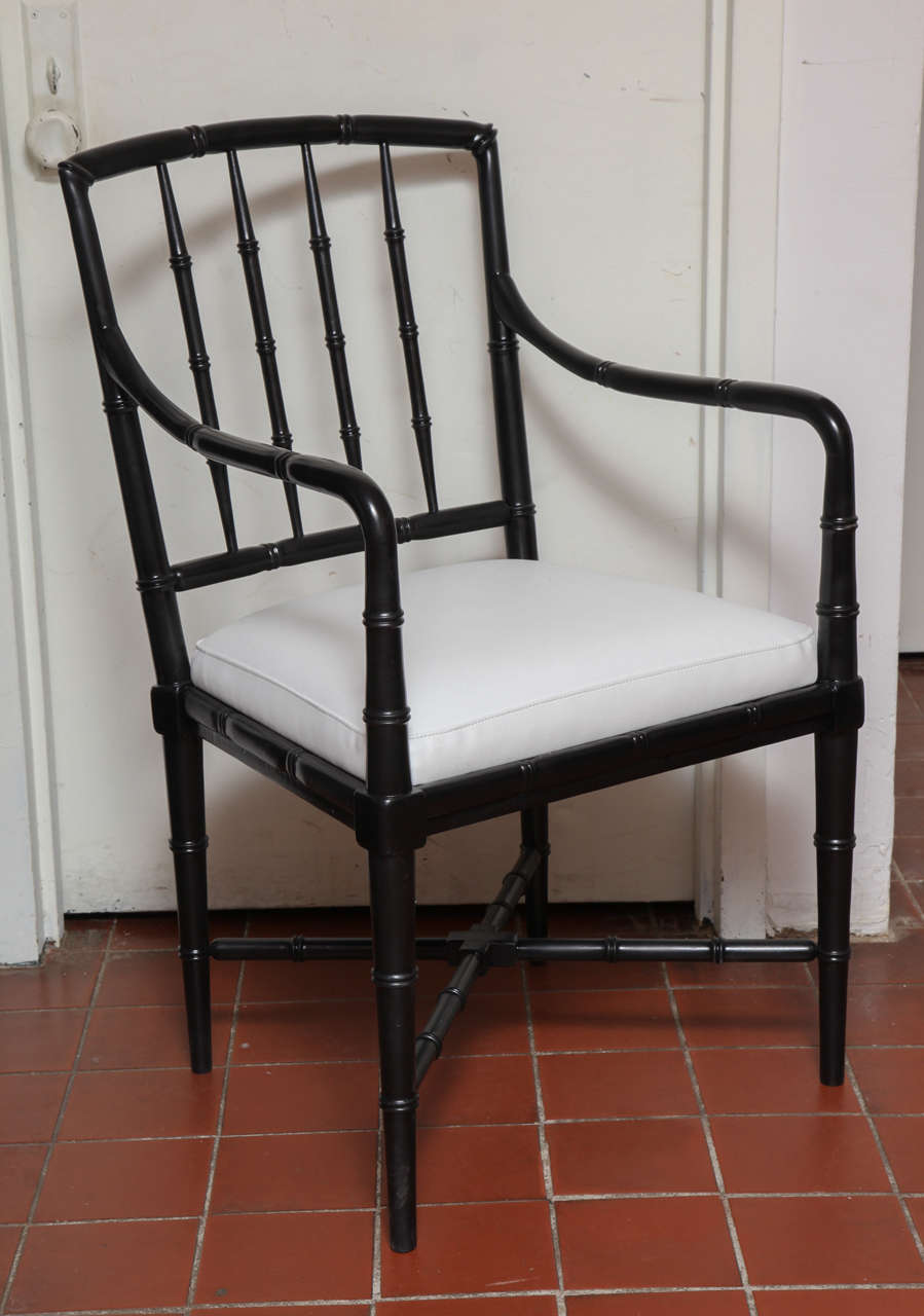 This early 18th Century Windsor fiddle back chair retains its original design. It was updated with black paint and new cushions in faux leather. The organic form is very comfortable along with the ideal height of its arms. The surface is perfect and