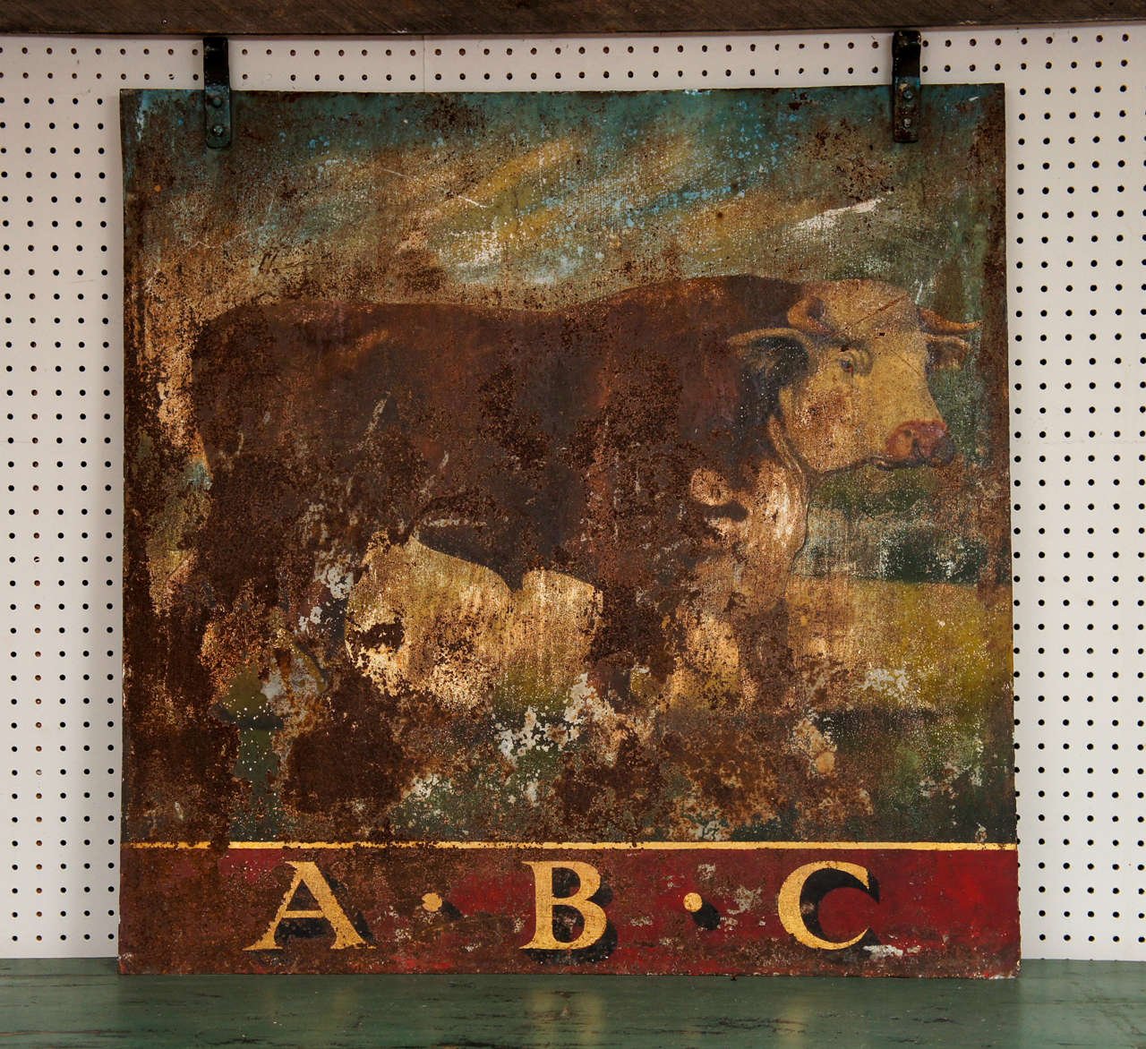 - A huge hand painted Hereford bull is the centerpiece of this early 20th Century two sided English butcher shop sign. The sign is all original (a bit worn here and there but that makes it all the better), the iron hangers remain on the top and the