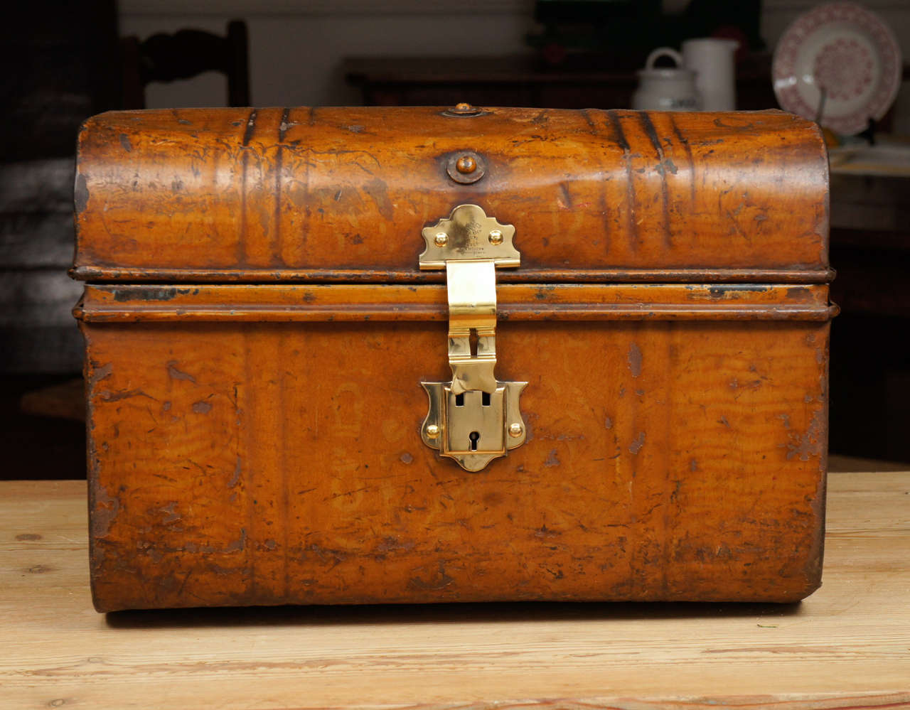This unique English metal trunk was typical of what luggage looked like in the 19th century. Everything about this piece is original. the ware is superb and even the inside has its original blue paint.Think of the items you can collect and store in