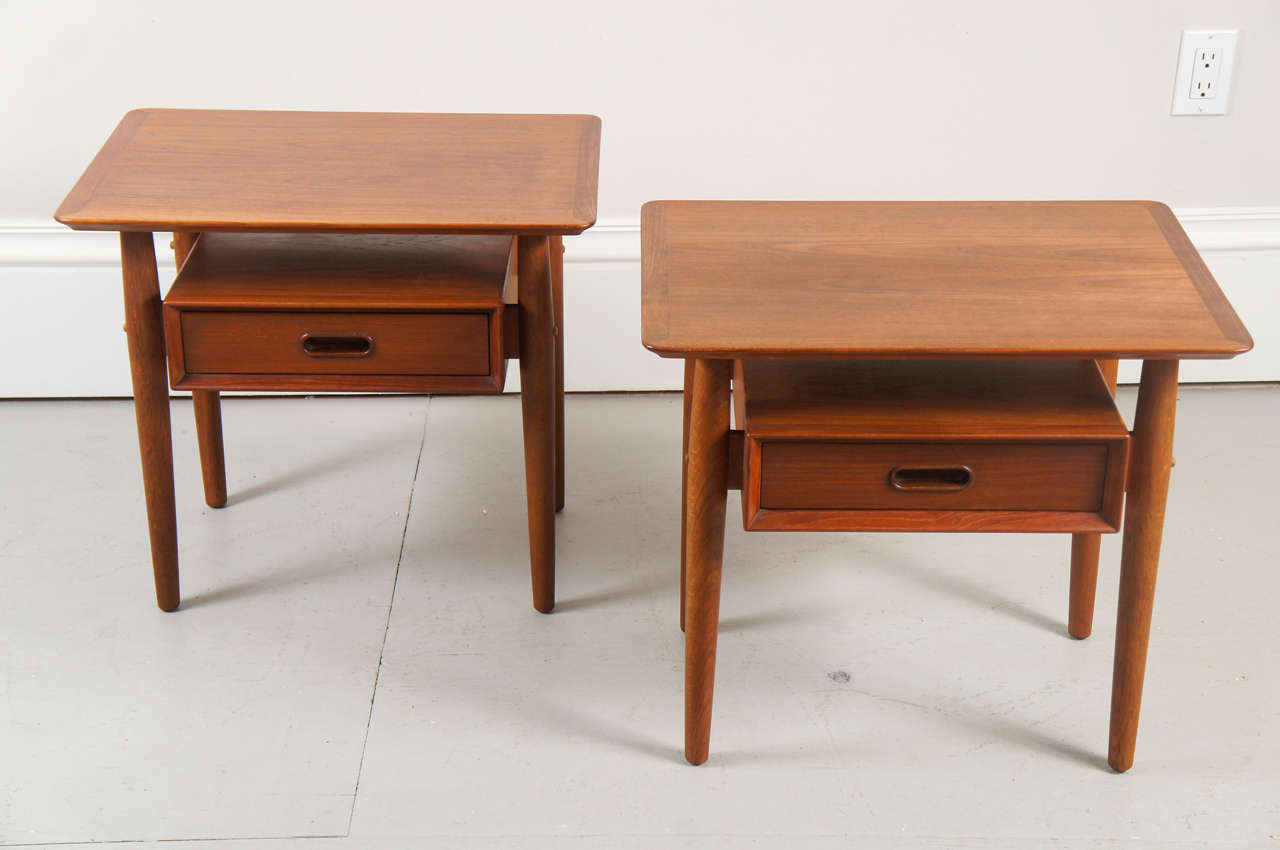 a very good looking pair of danish teak nightstands by Arne Vodder. The stands are labeled George Tanier Collection Sibast Moebler.