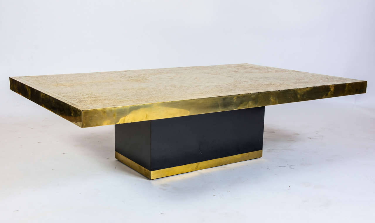 Etched brass cocktail table circa 1970,
The tray is engrave with acid. Geometric décor.
signed