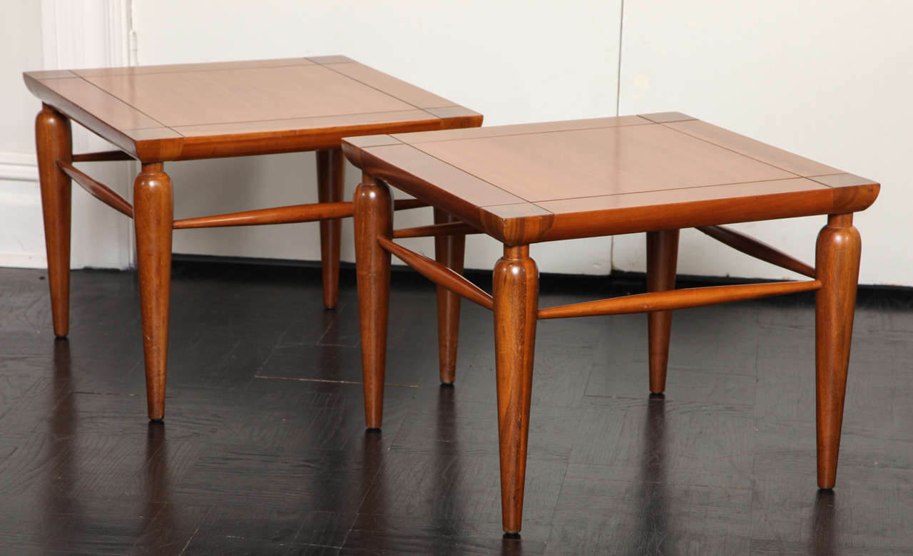 Pair of Mid-Century walnut tables, square tops on round tapered legs 
