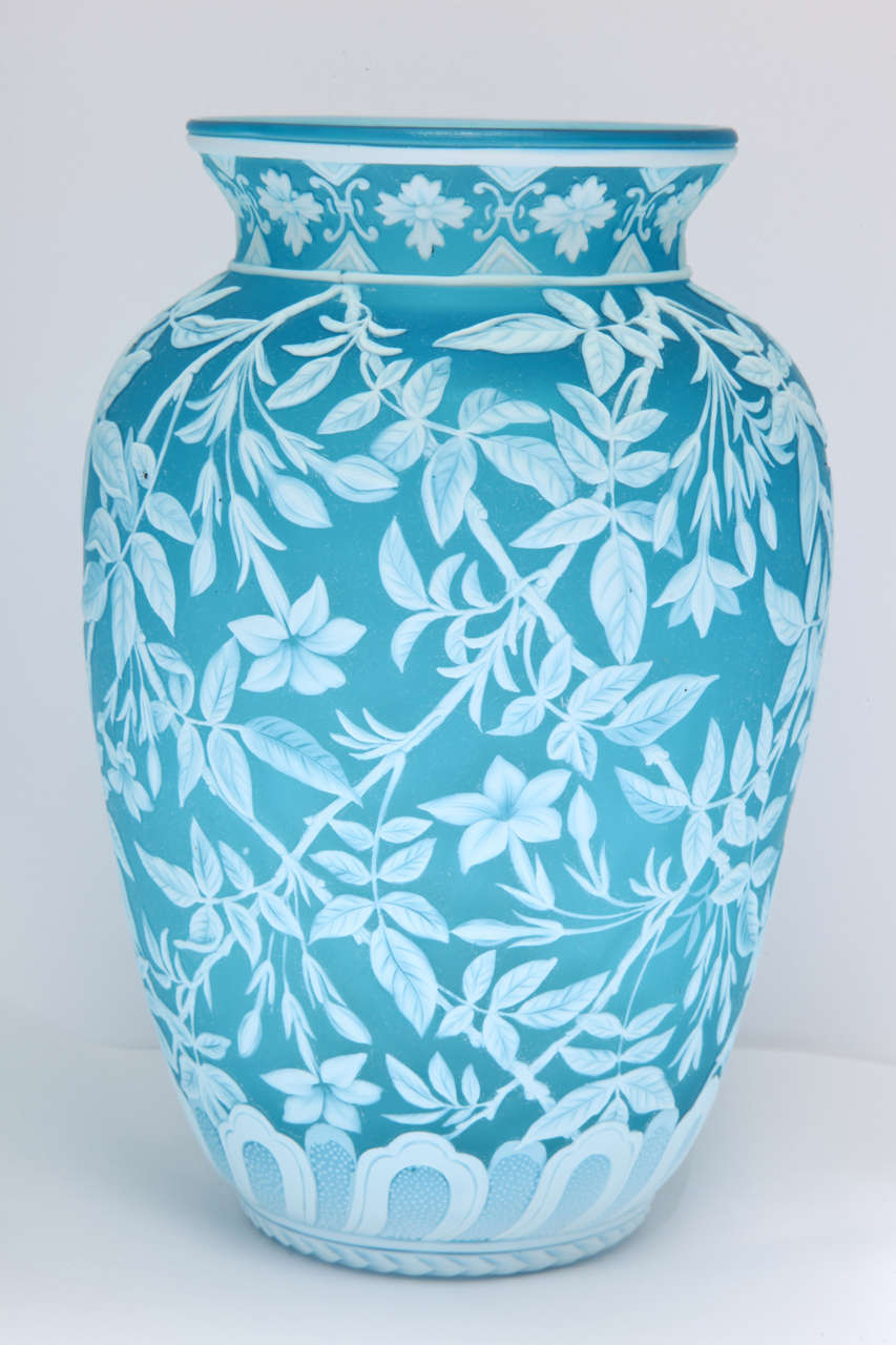 A rare and fine signed Thomas Webb & Sons, Gem Cameo, turquoise and white cameo glass vase, carved with an all over floral and leave pattern