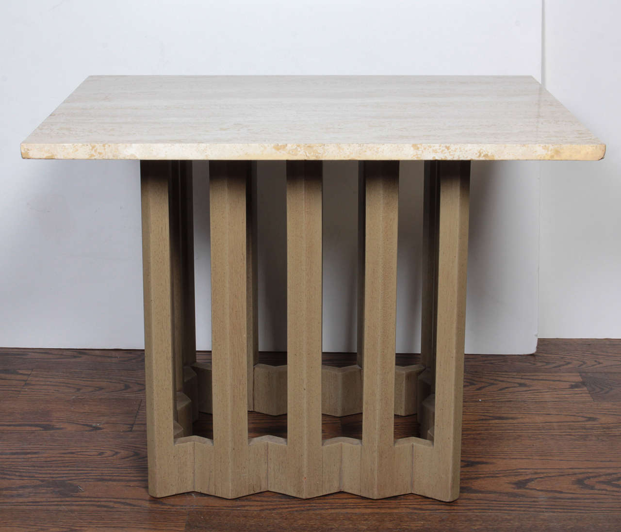 An unusual wood and travertine marble side table by Harvey Probber.